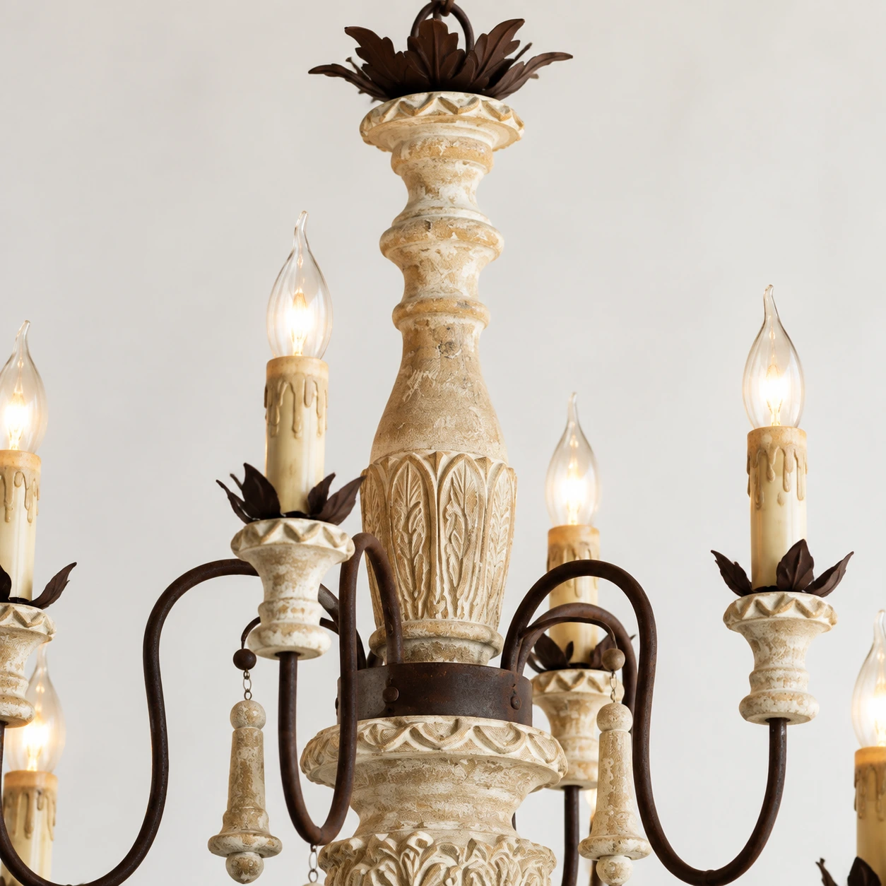 Carved wood relief detail on the chandelier