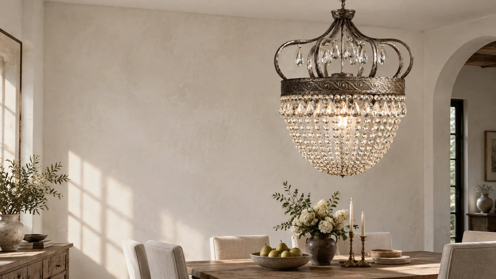 Vintage crown crystal chandelier in a naturally lit dining room