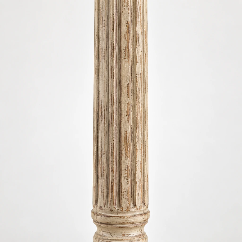 Close detail of the distressed fluted carved wood column