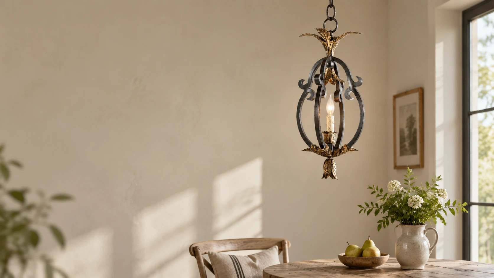 Petite open iron cage pendant in a vintage dining nook