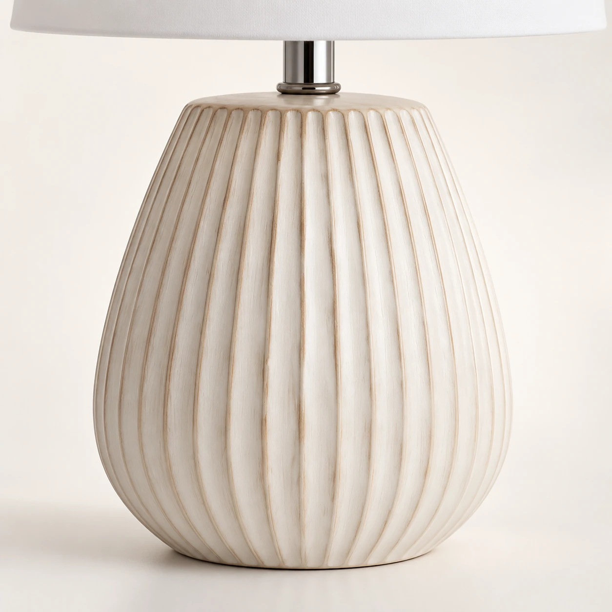 Close detail of the fluted carved wood lamp body