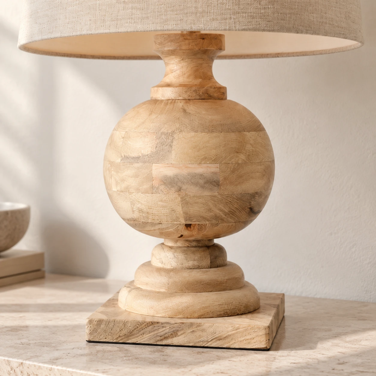 Natural solid-wood urn and stepped base close detail