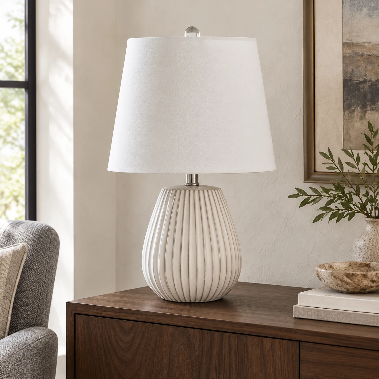 Clara table lamp on a dark walnut living room sideboard