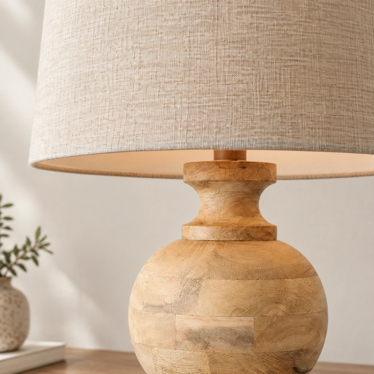 Woven drum fabric shade and wooden neck close detail