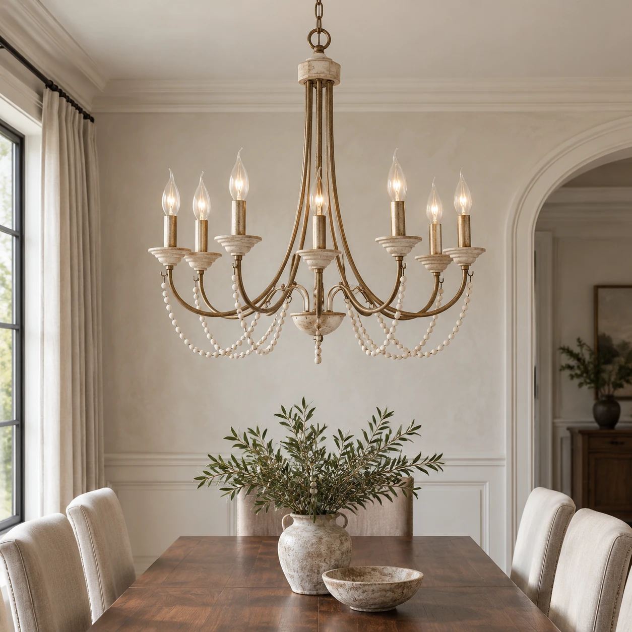 Antique gold eight-light wood bead chandelier in a dining room