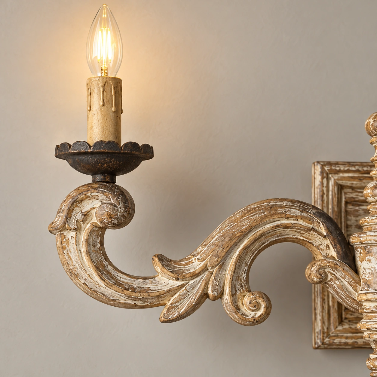 Candle-style holder and curved iron support detail