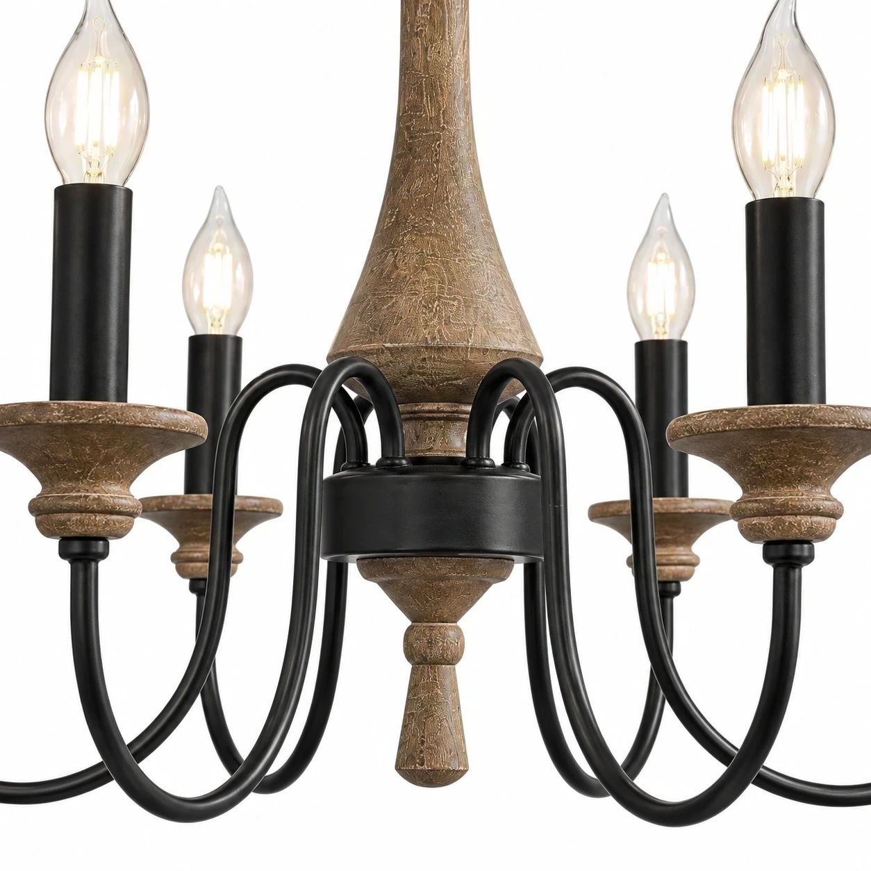 Carved wood center and curved black arms of the chandelier