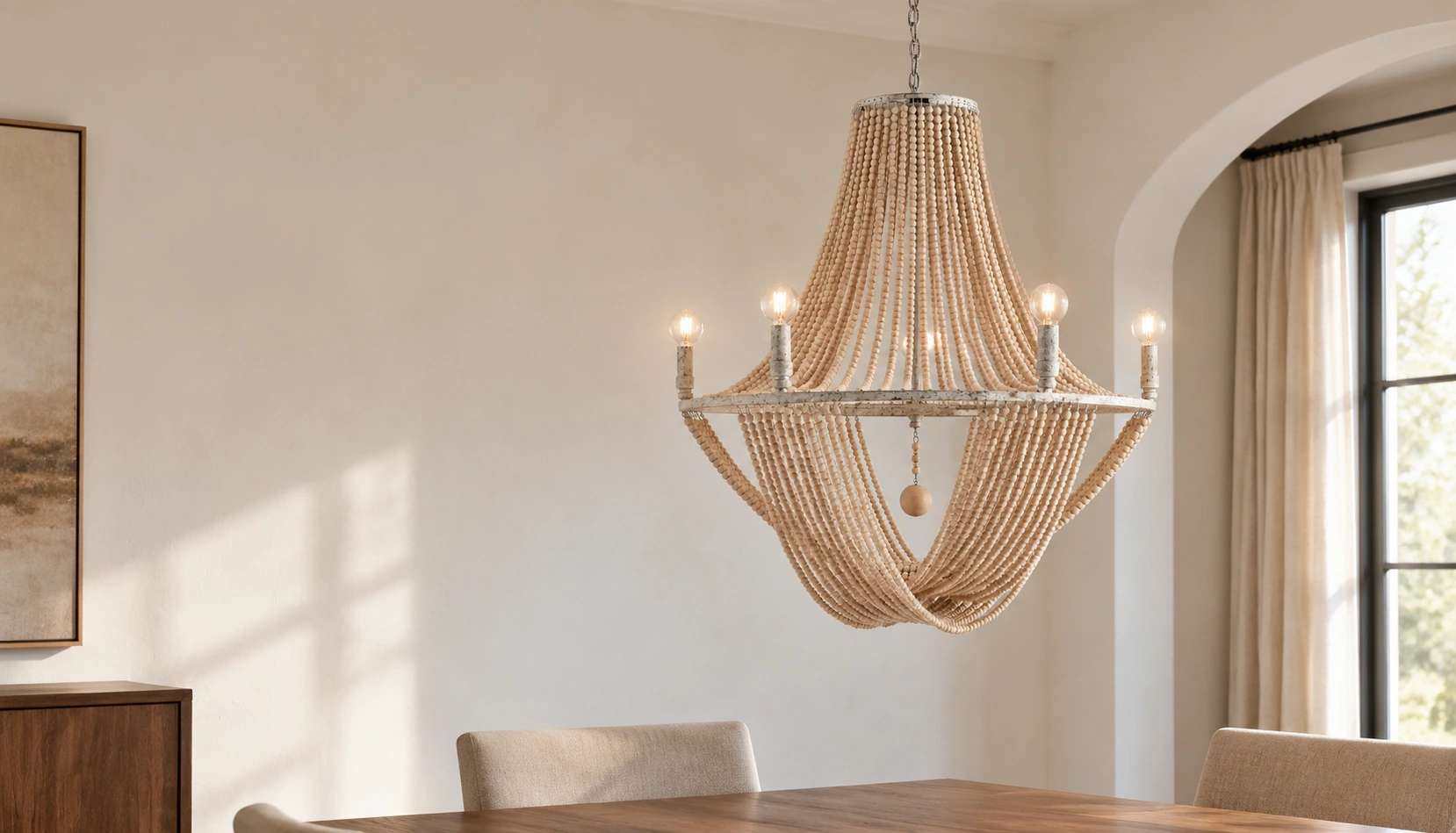 Elena wood bead chandelier suspended above a dining table