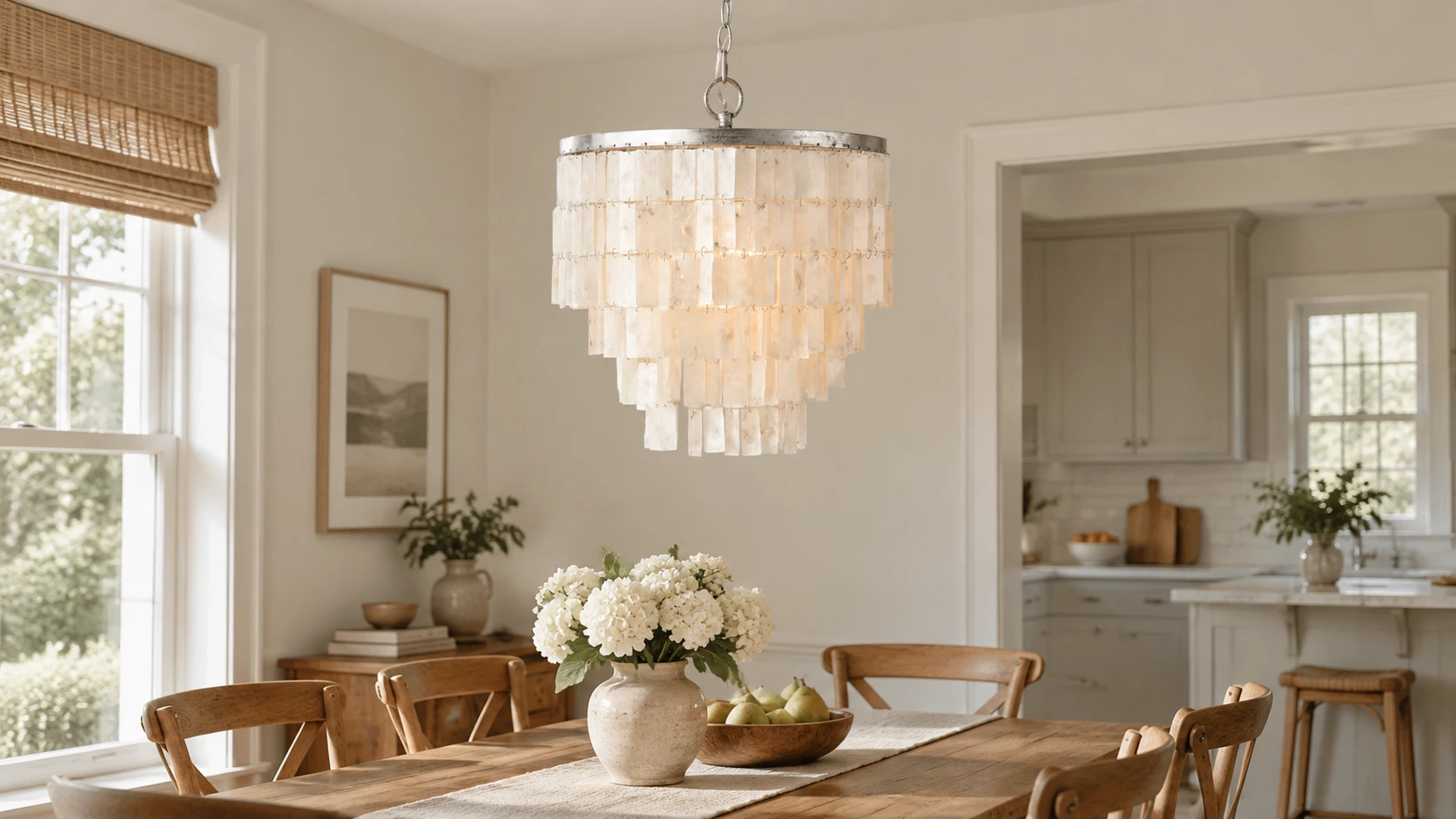 Tiered iron shell chandelier above a walnut dining setting