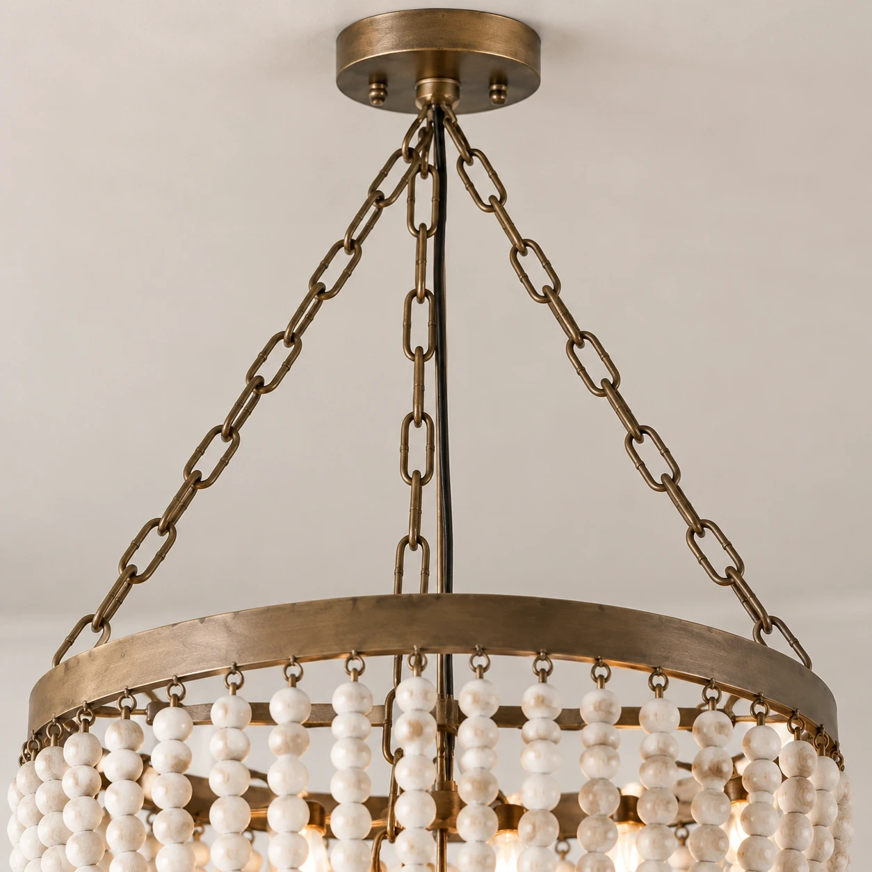 Close view of Mara French Vintage Relief Floral Ceramic Wood Pendant Light lower ceramic rim and warm diffuser opening