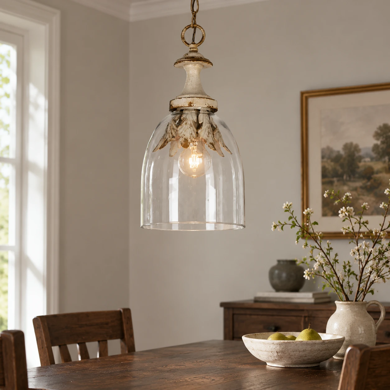 Bell-shade glass pendant above a dining table