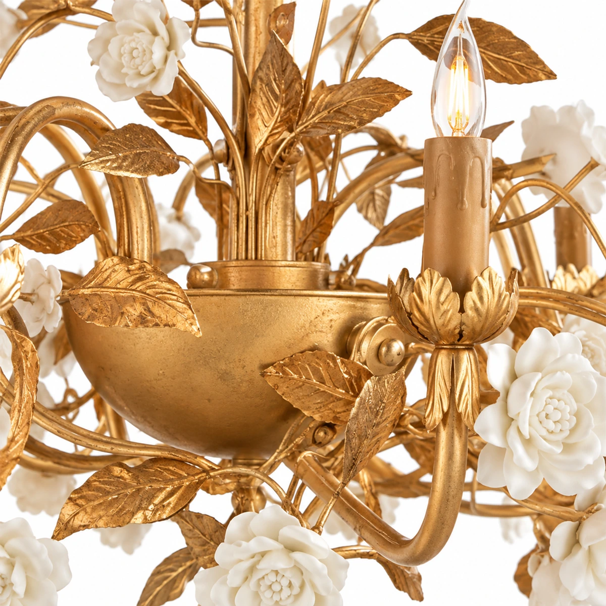 Close detail of Elara matte-gold iron leaves and branches