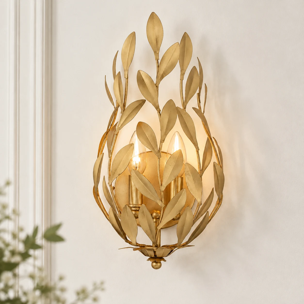 Close view of Elise's two candle-style sockets behind the gold leaves