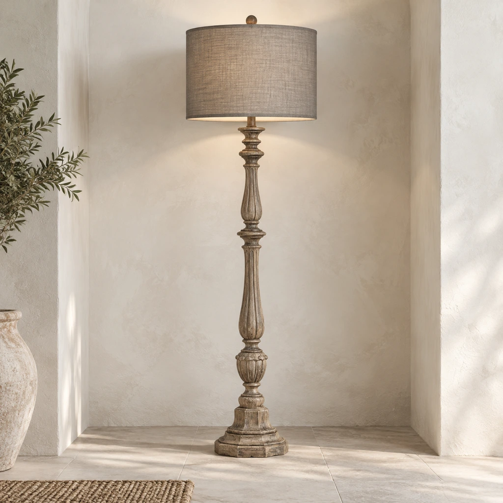 Merritt carved wood floor lamp illuminated in a pale architectural alcove