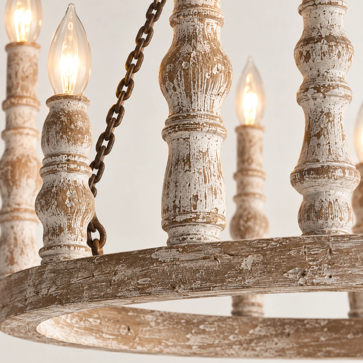 Close view of carved distressed wood chandelier details