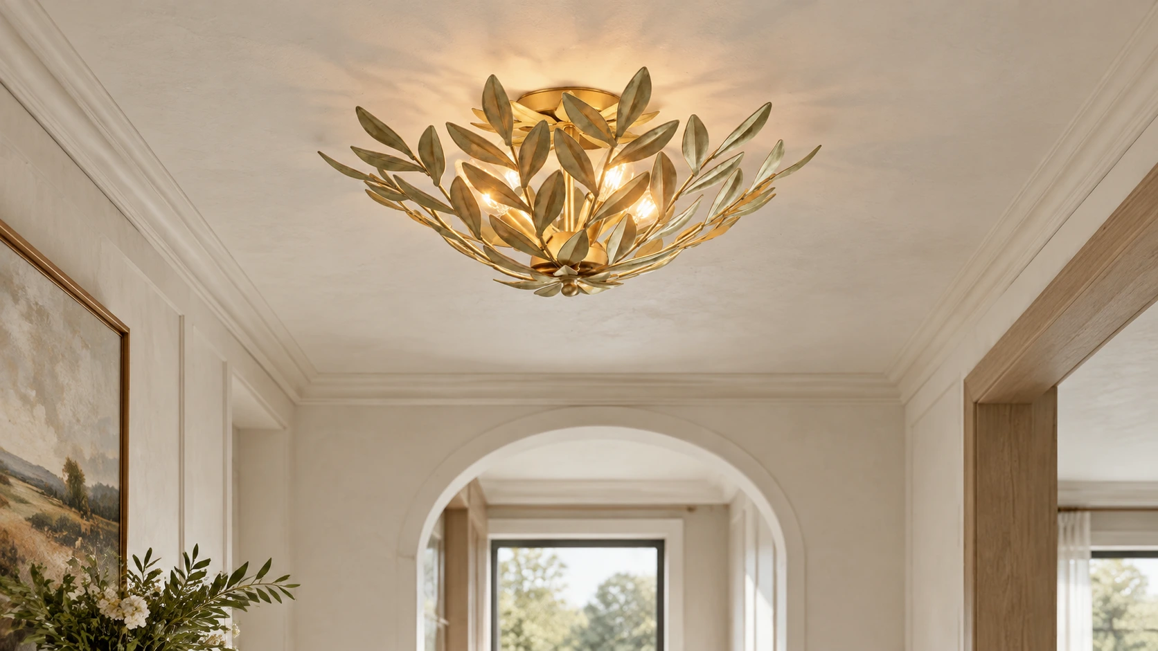 Golden leaf iron flush mount ceiling light in a refined French-country hallway