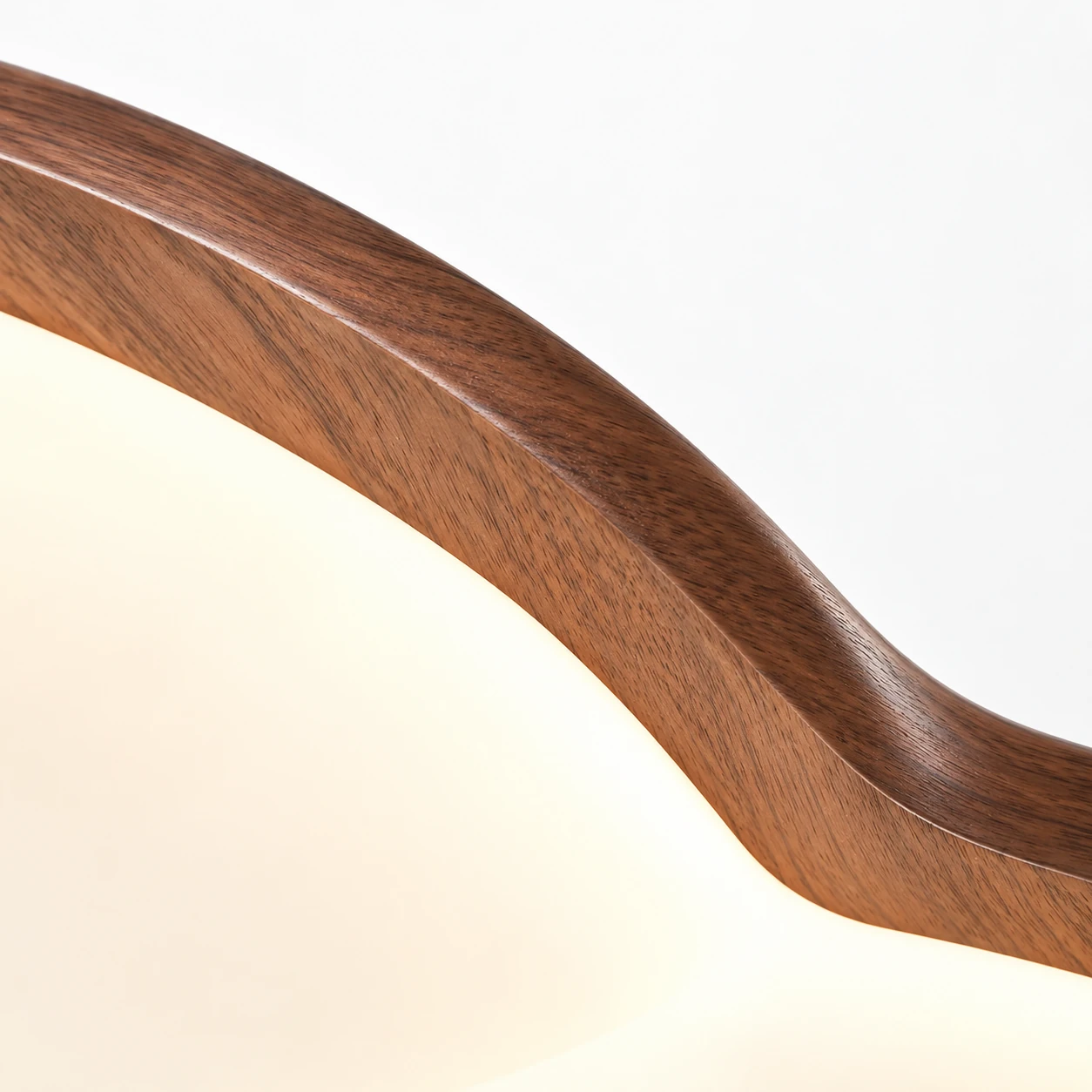Walnut-finish edge and diffuser join detail