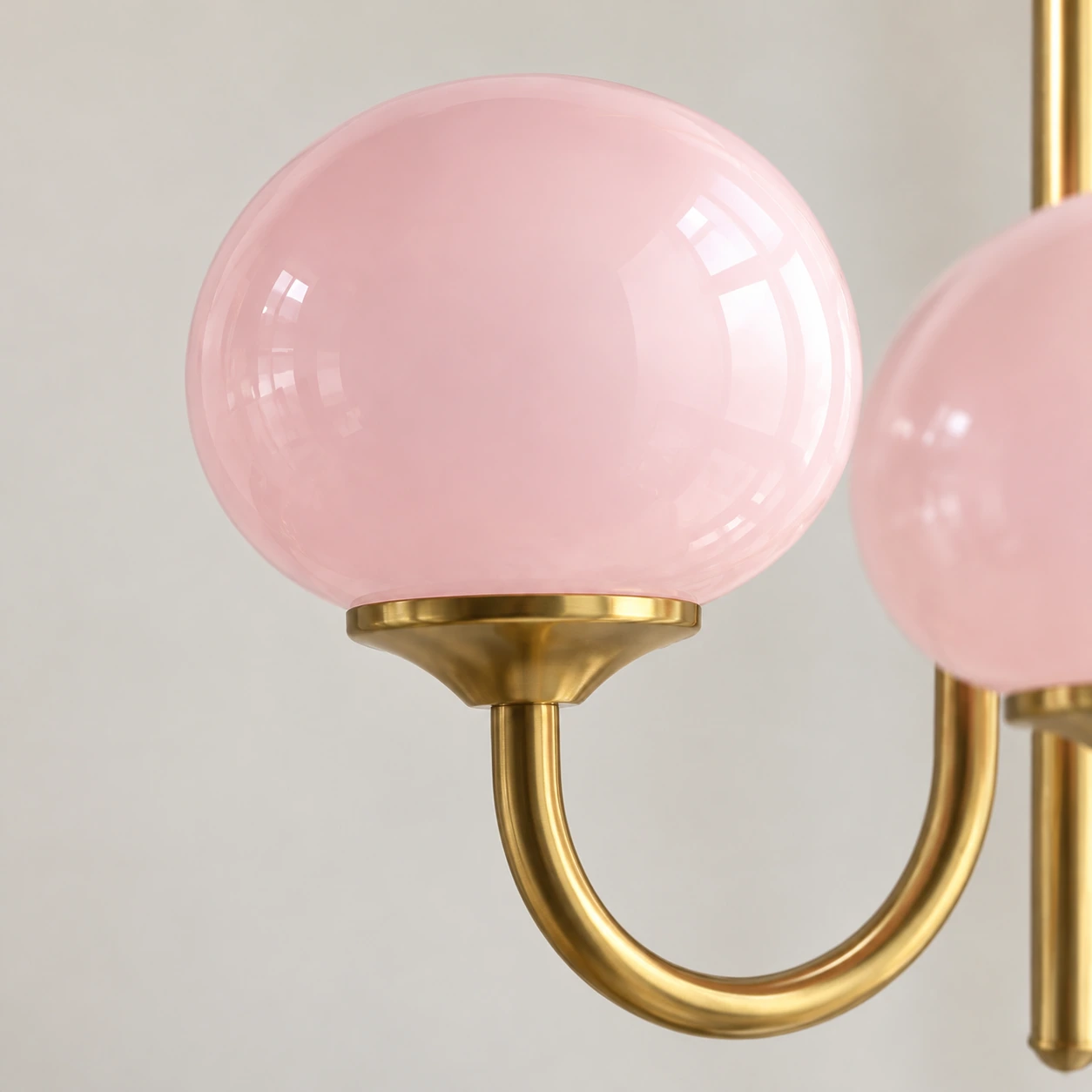 Close detail of a rounded pink glass shade