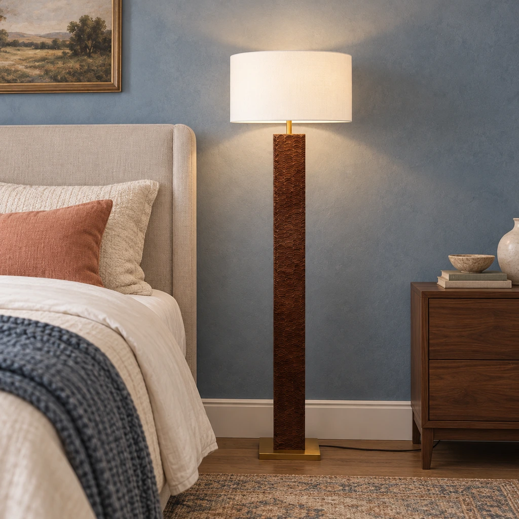 Nora textured wood floor lamp beside an upholstered bed