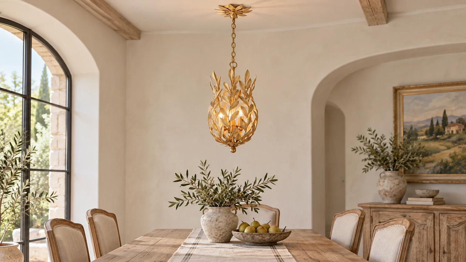 Aurelia leaf cage pendant light above a dining table in a bright French-country interior