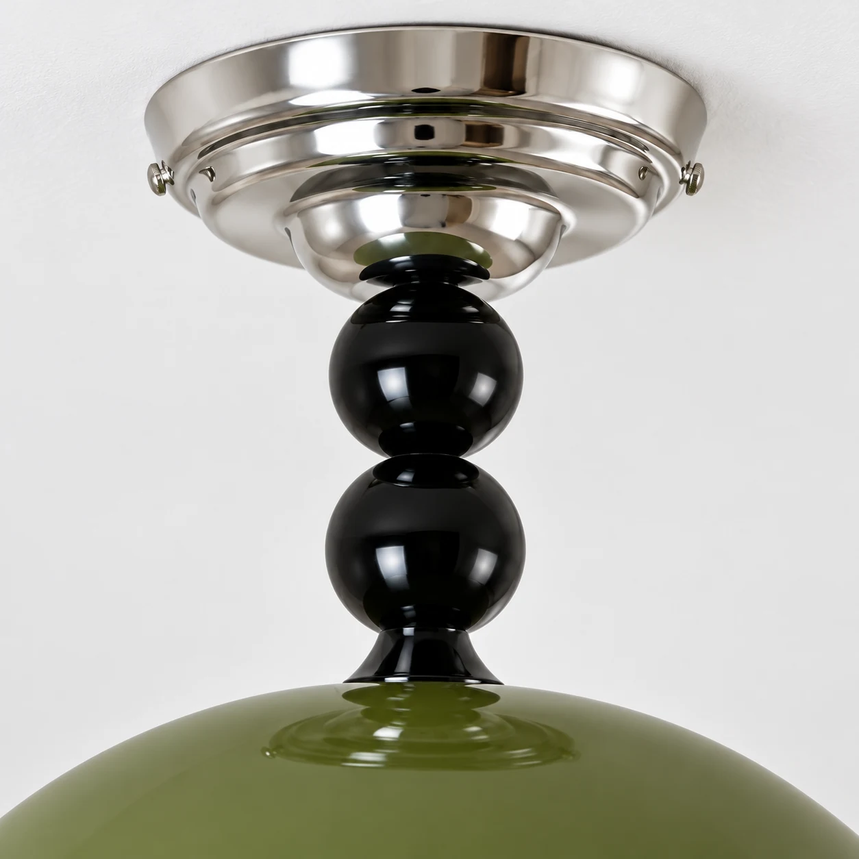 Close detail of the chrome metal canopy and black bead connection