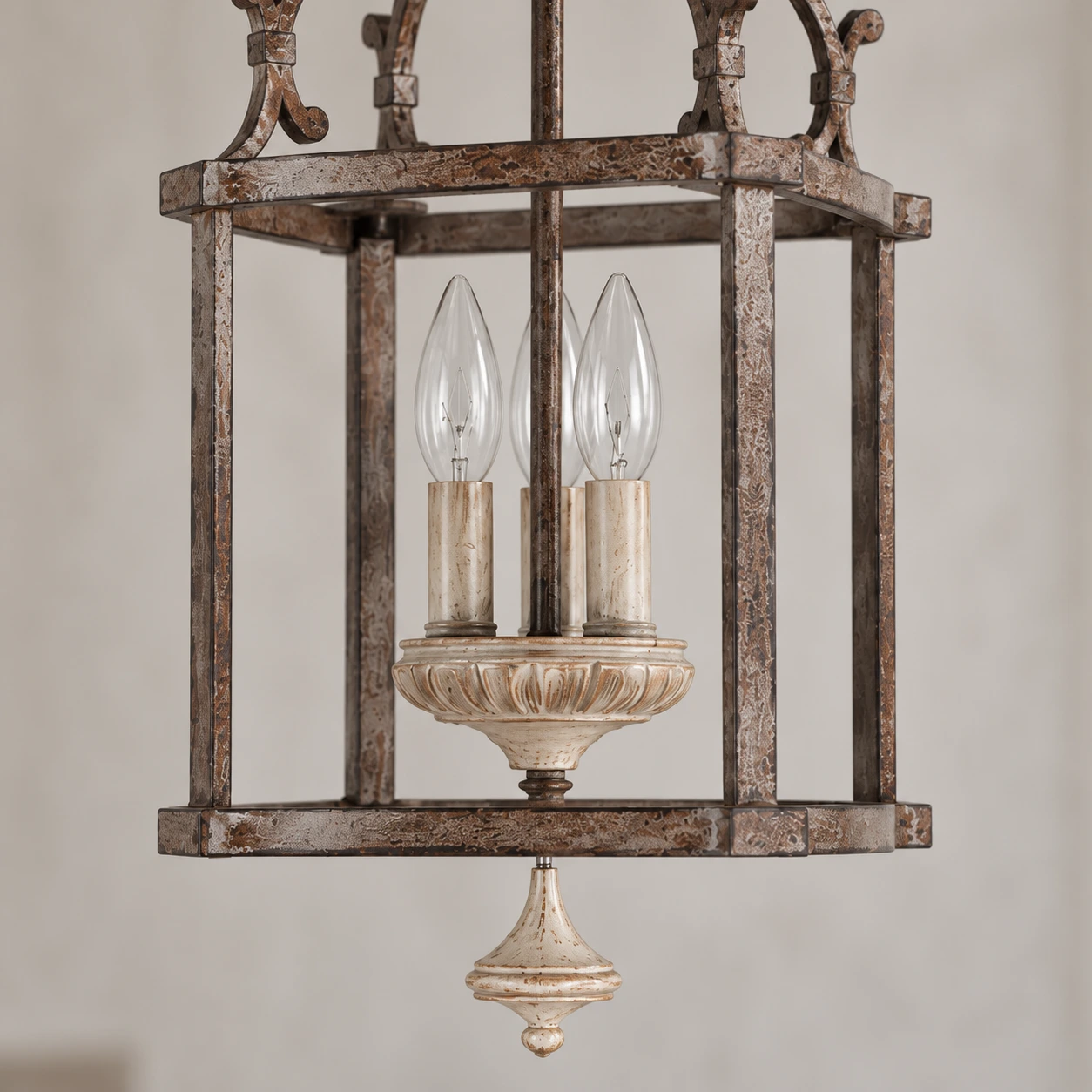 Close detail of the central light arrangement, iron frame and lower finial