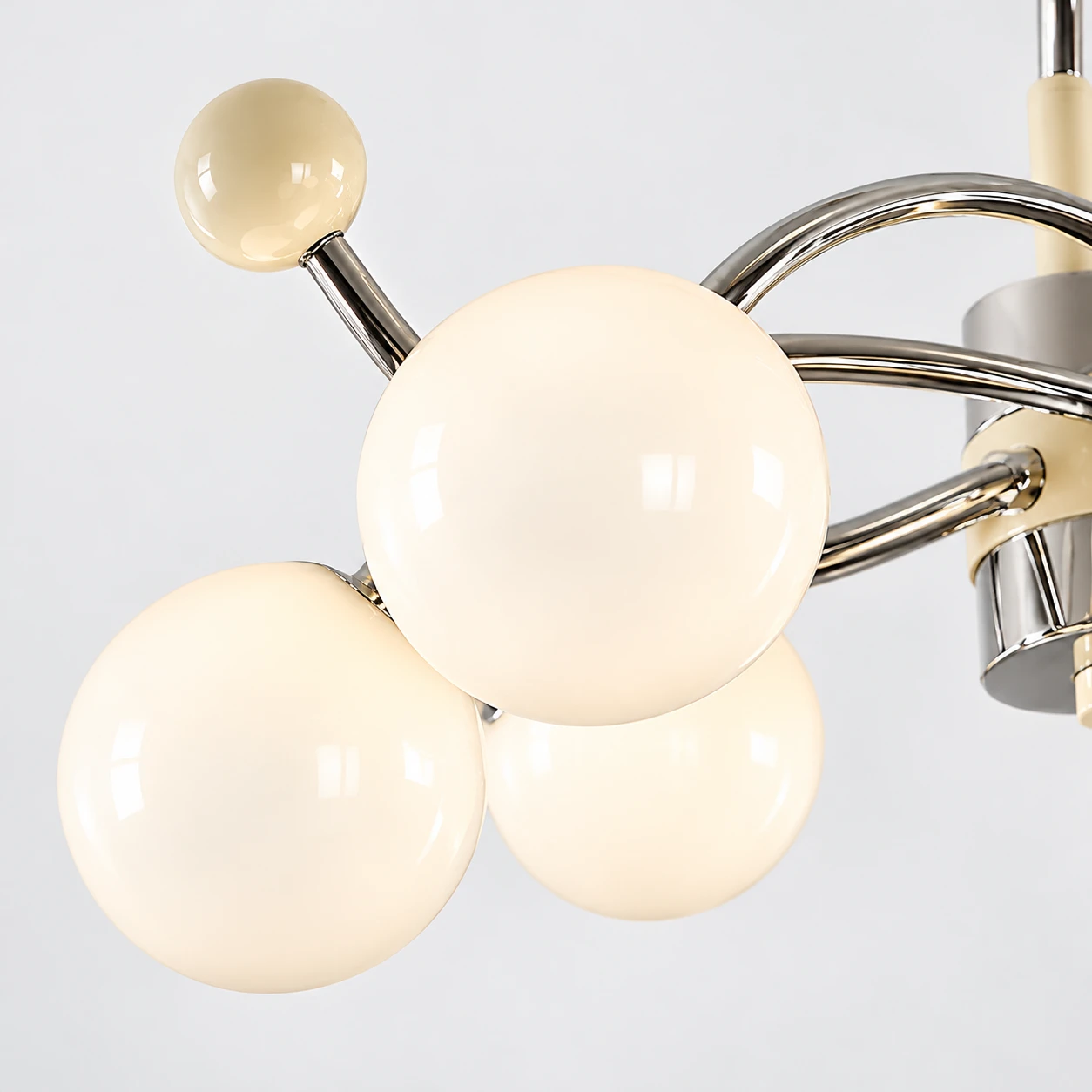 Opal glass globe cluster with small cream finial
