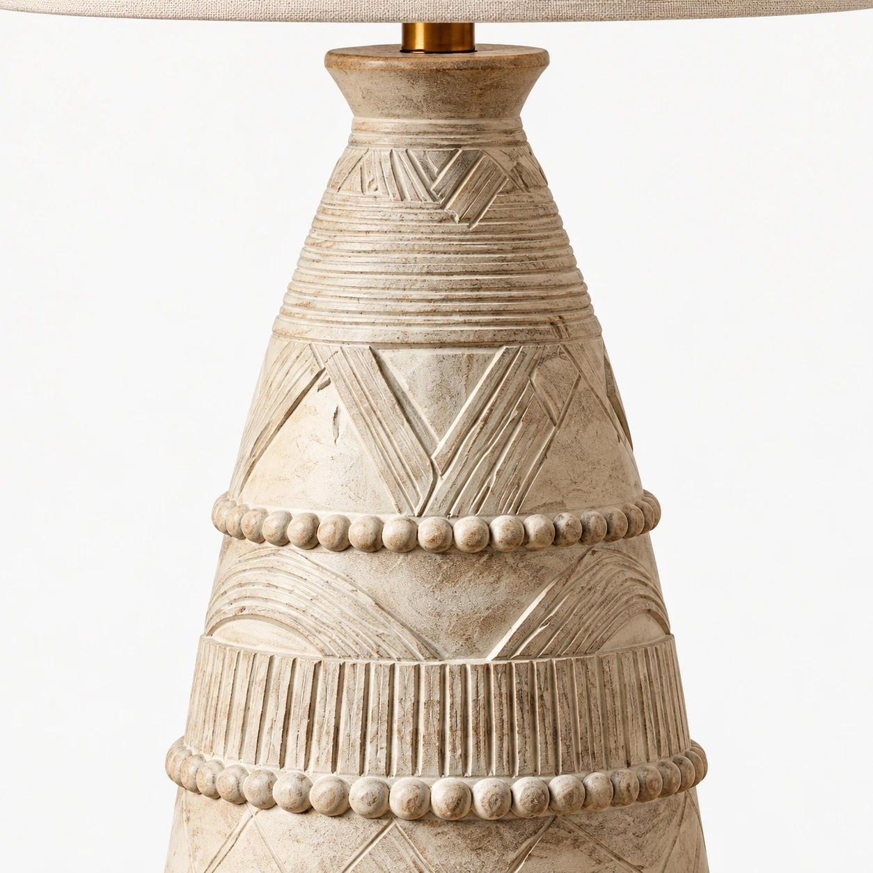 Close view of the carved ivory wood lamp base