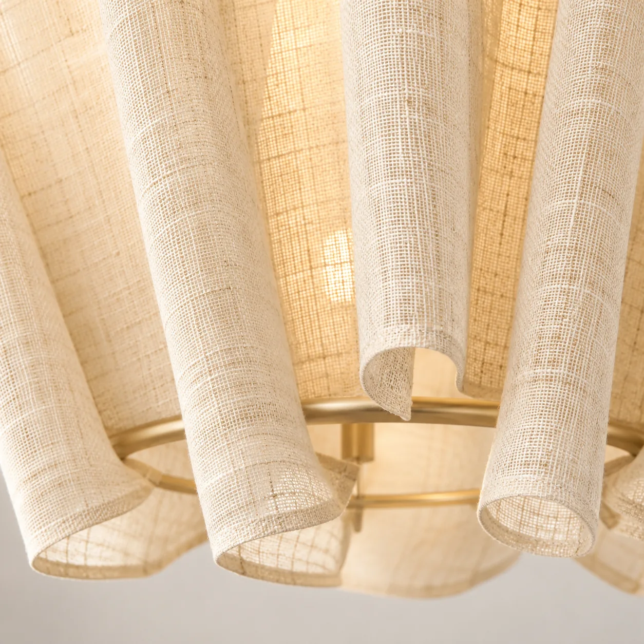 Close view of linen folds and brass lower ring