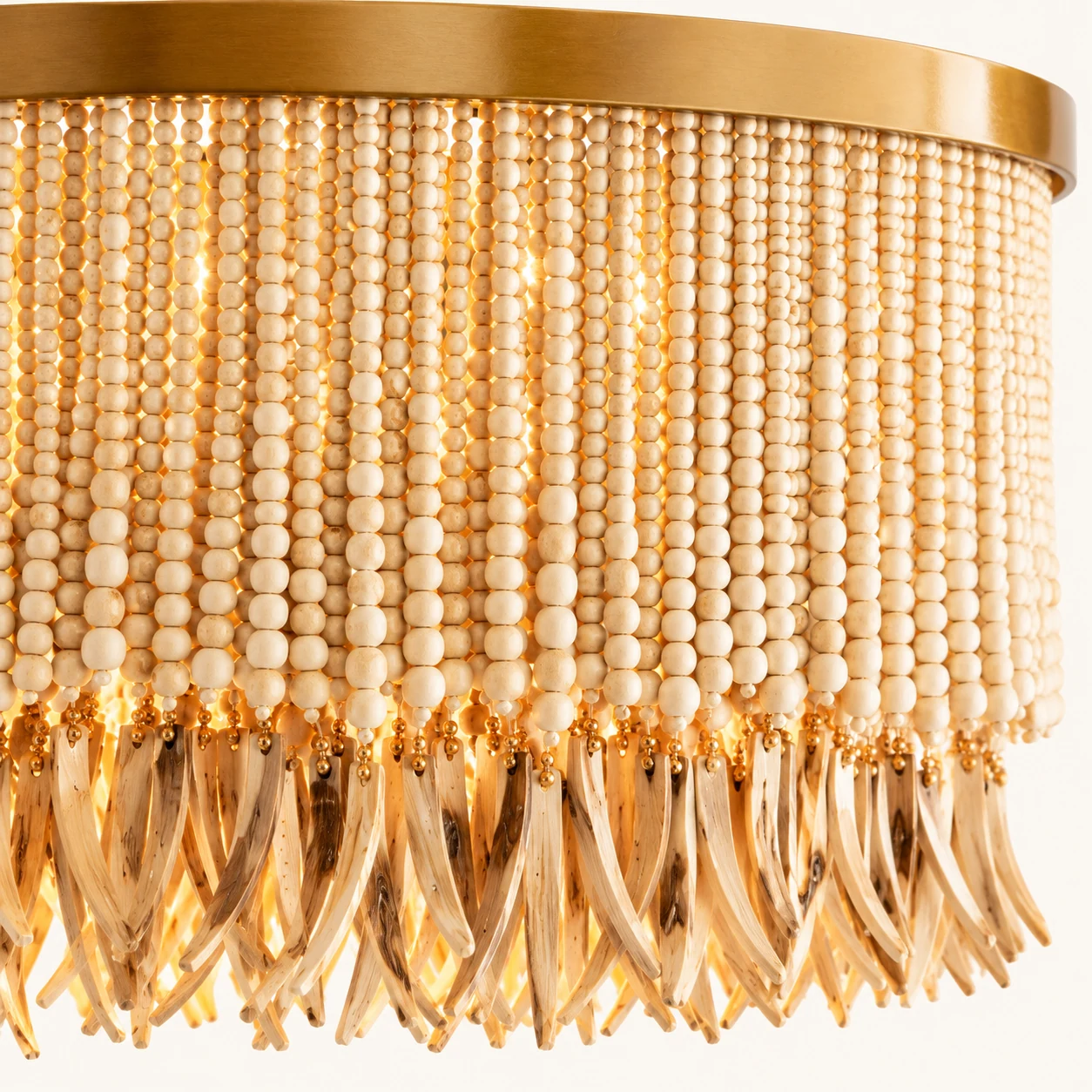 Close detail of natural wood beads and gold fittings on the Liora chandelier