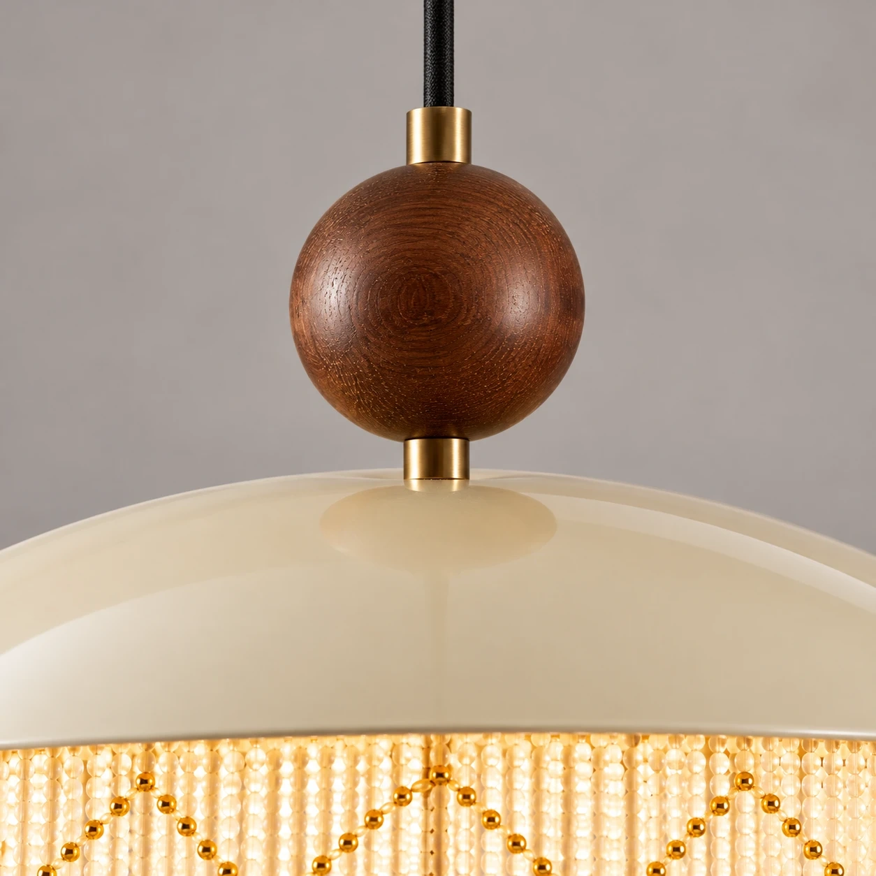 Close view of the upper solid wood sphere and metal shade junction