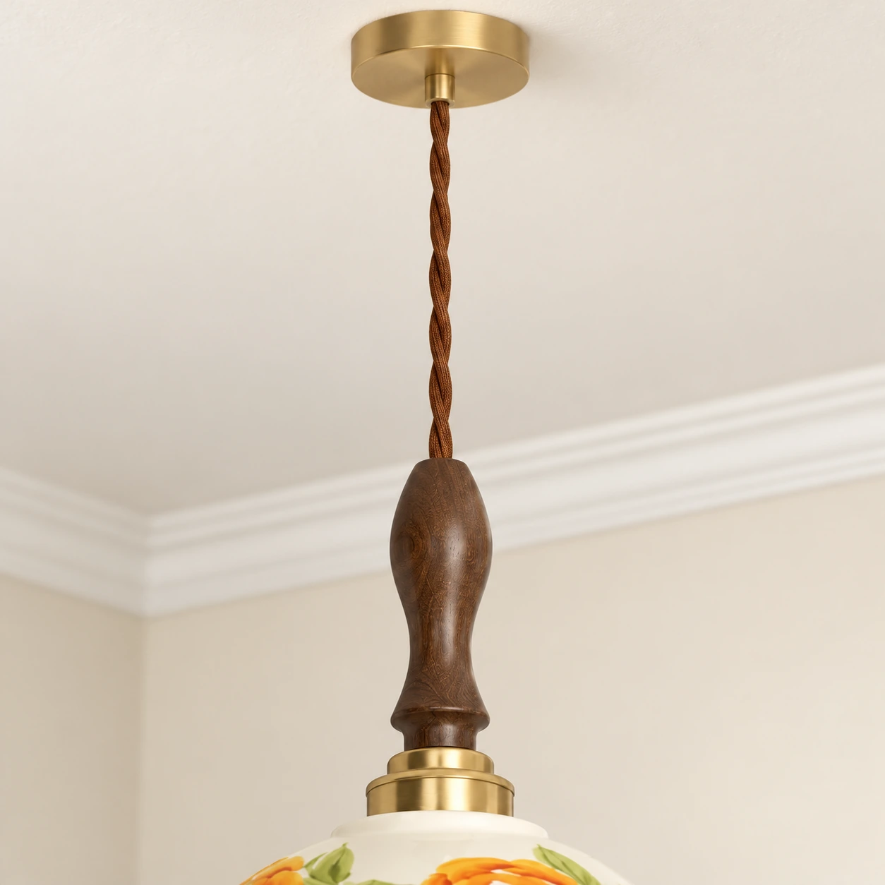 Close-up of brass canopy cord walnut stem and brass collar