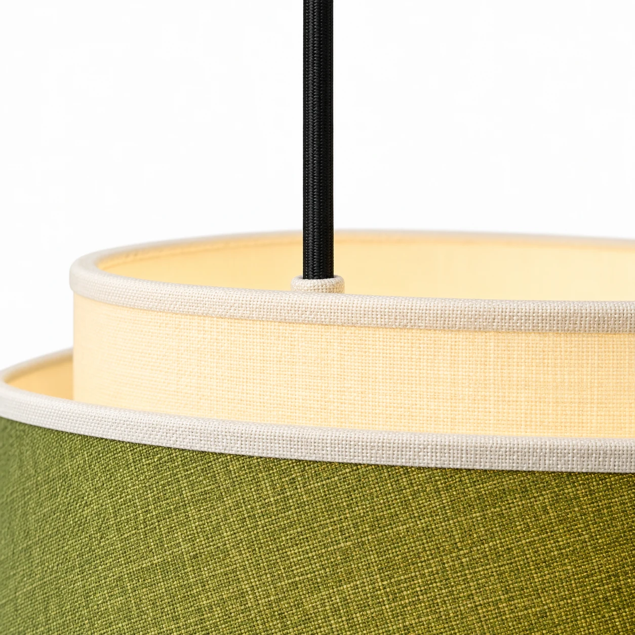 Black suspension cord joining the cream top rim of the shade