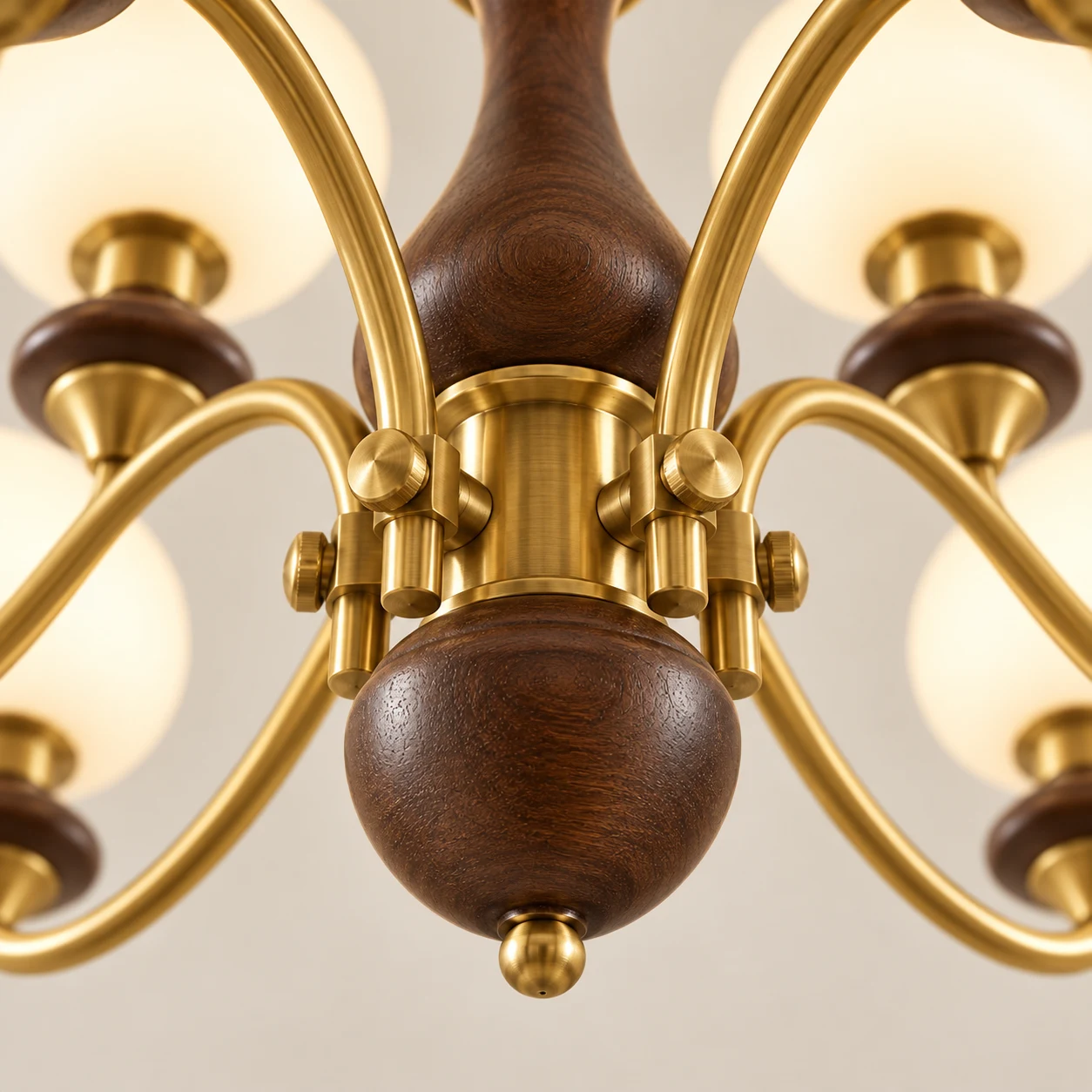 Upward view of central walnut finial and brass hub