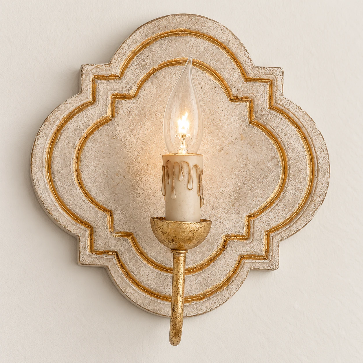 Close detail of the carved cream wood quatrefoil backplate