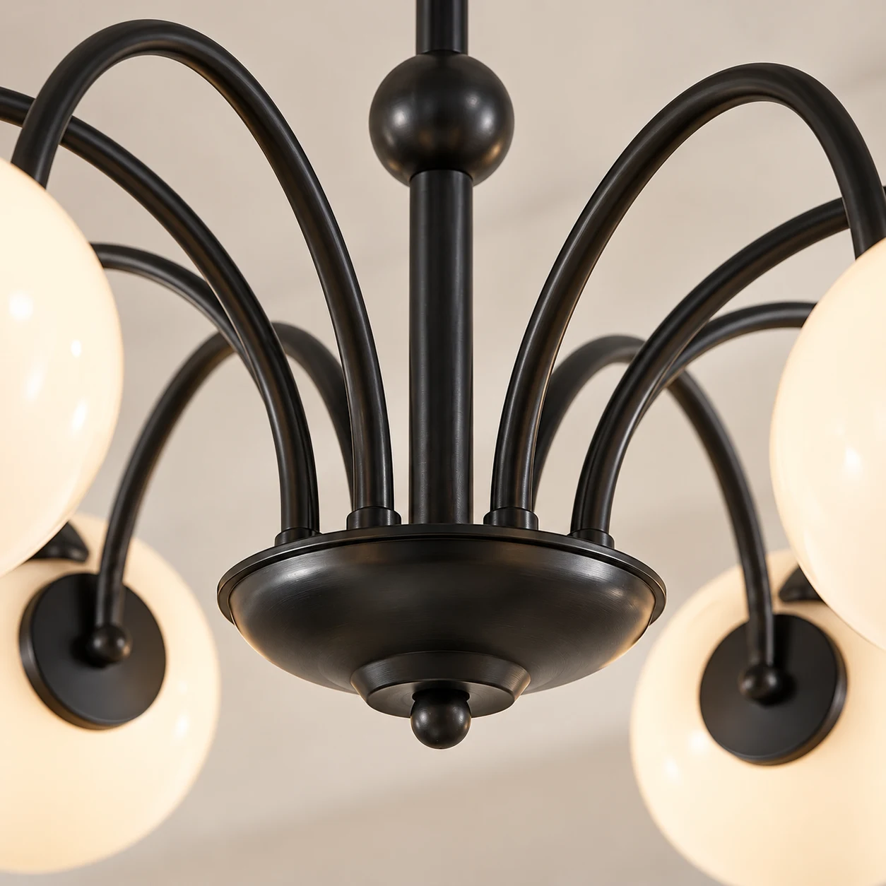 Black iron hub and curved arm junction detail