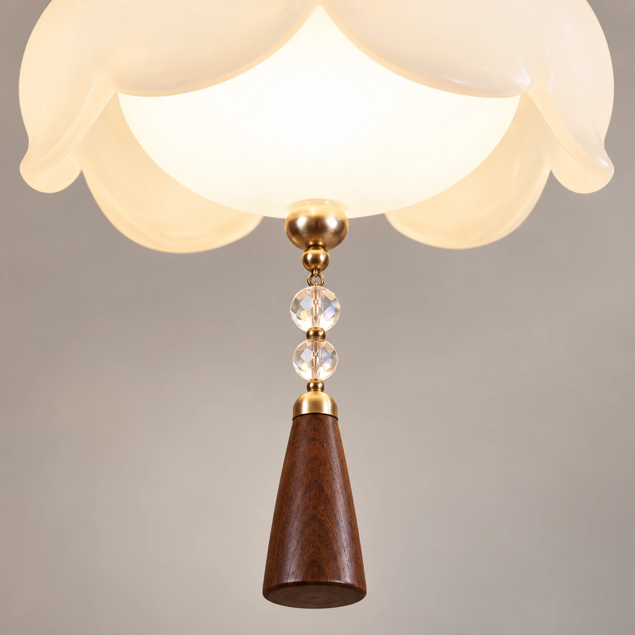Close detail of crystal beads and wood tassel finial