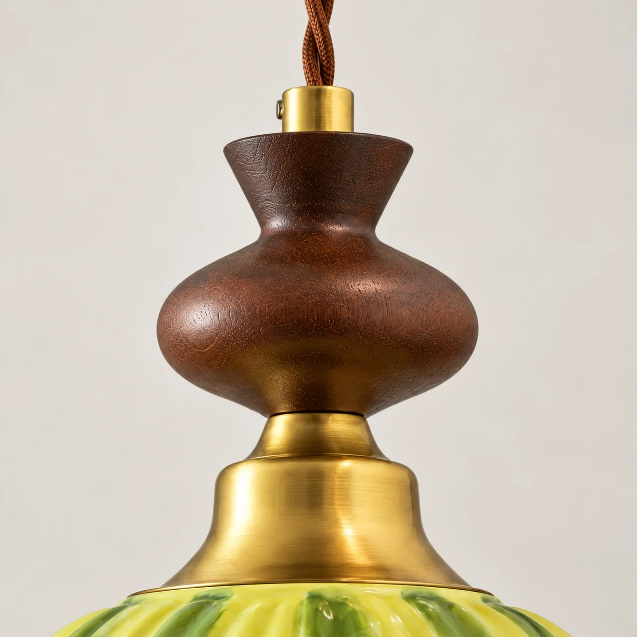 Dark walnut wood gourd body and brass cone collar detail